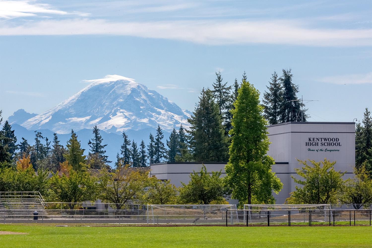 Exterior of Kentwood High School with mountain range in the background