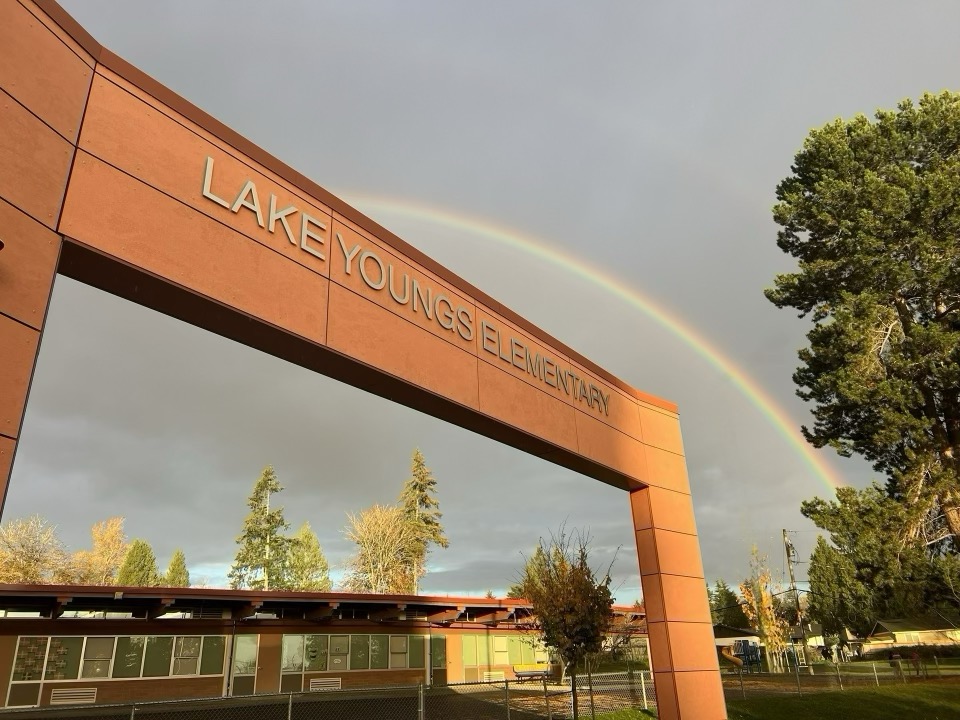 Lake Youngs Elementary School sign with rainbow above