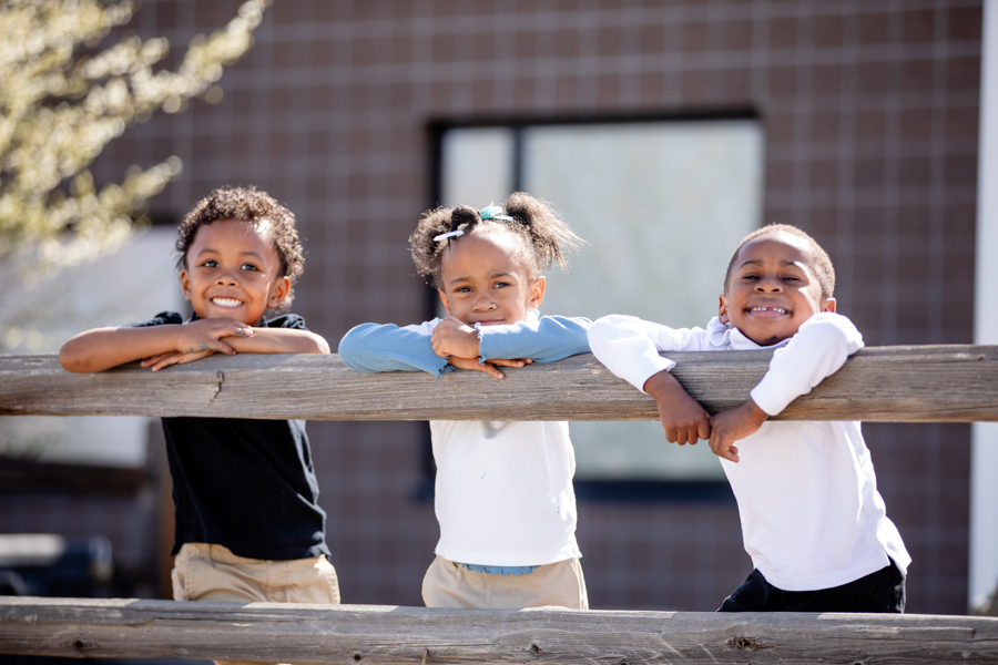 students by fence