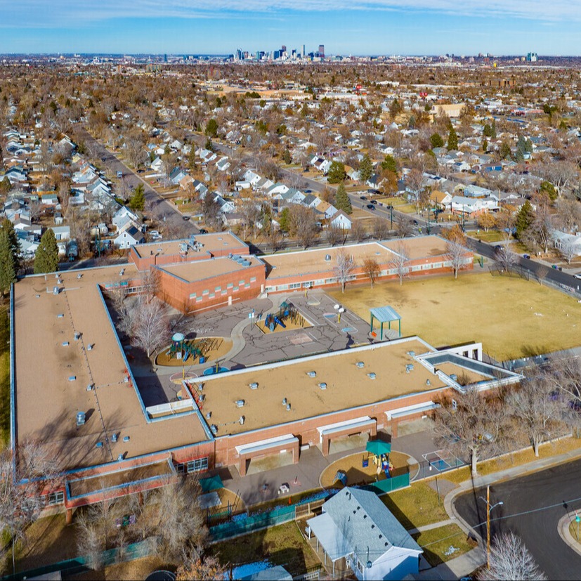 picture of seven students sitting in a school library