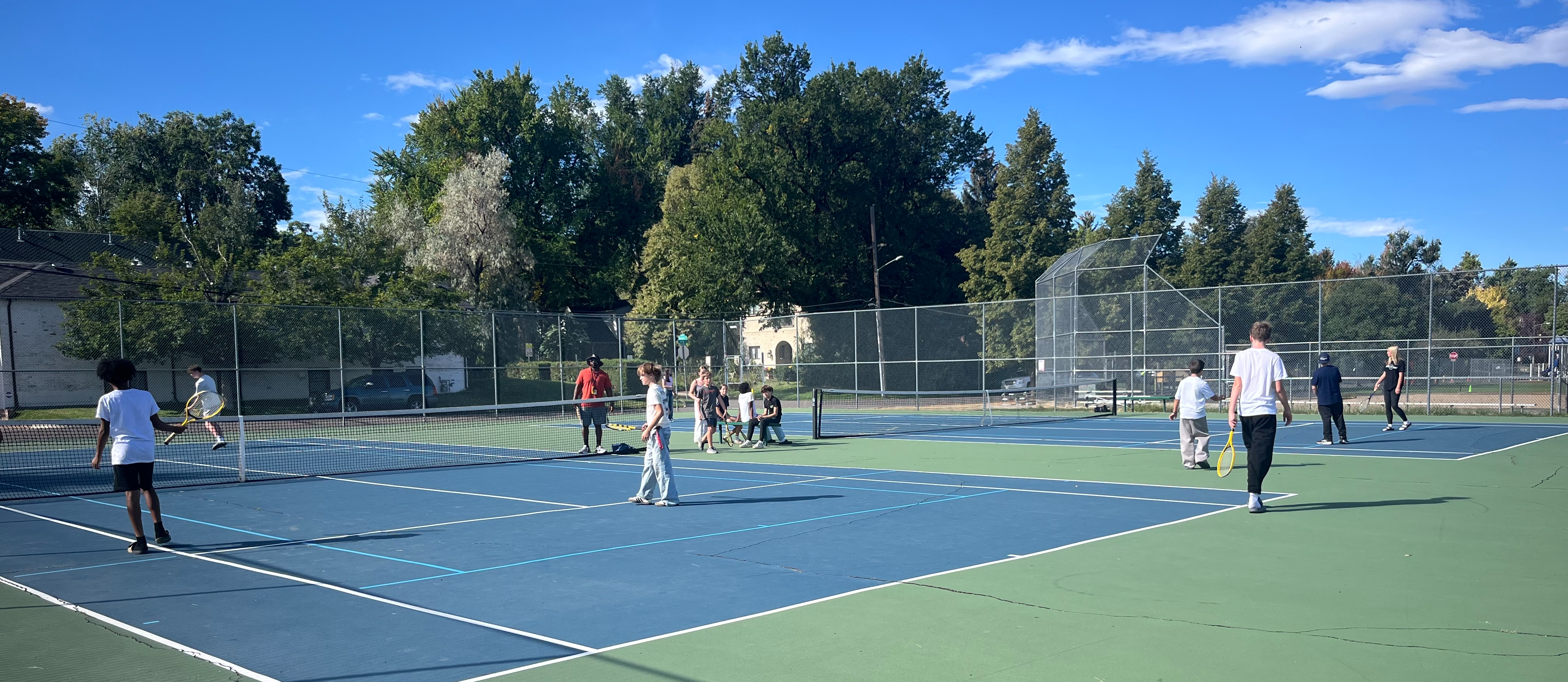 photos of students playing tennis
