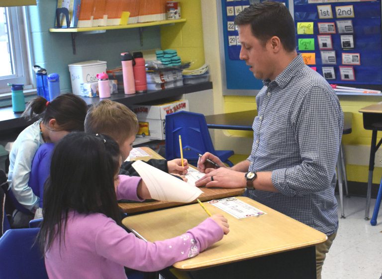 Teacher and three students