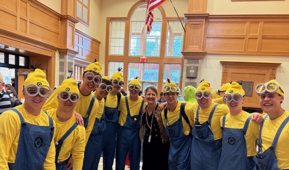 An image of Dr. Spash with a group NHS Seniors dressed as Minions.