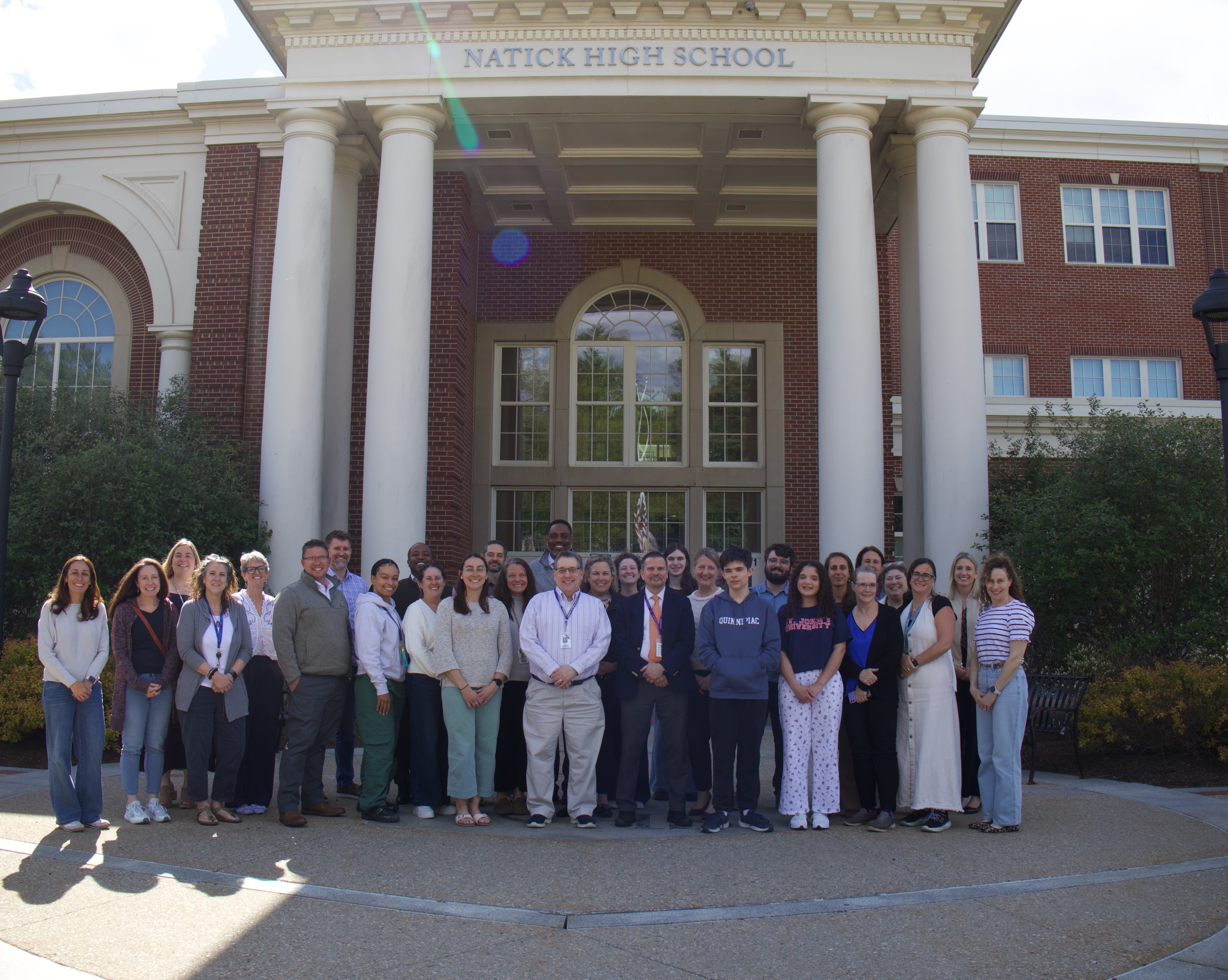 Strategic Plan Committee Group Photo in Front of NHS
