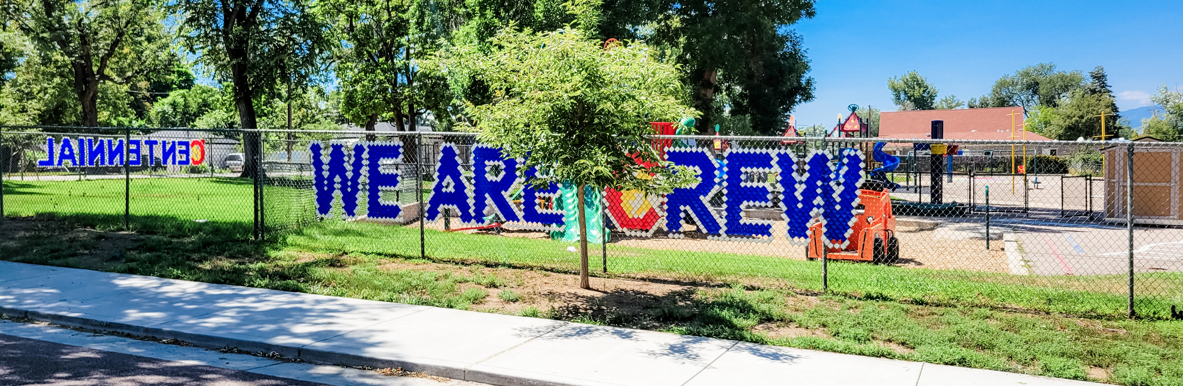 Fence reading "WE ARE CREW"