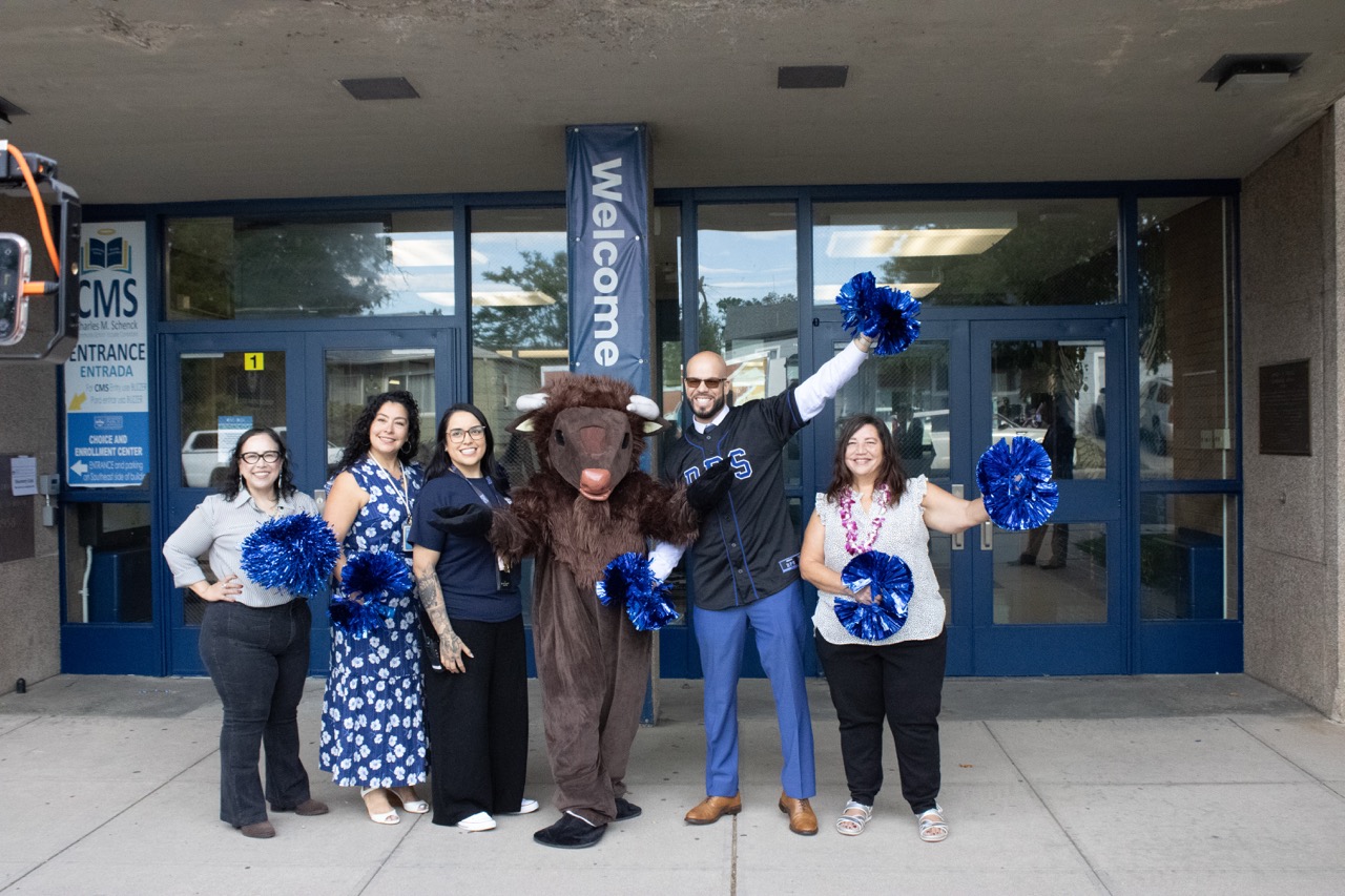 Dr. Marrero, Bufalin, prinical and school board members greeting students on the first day of school