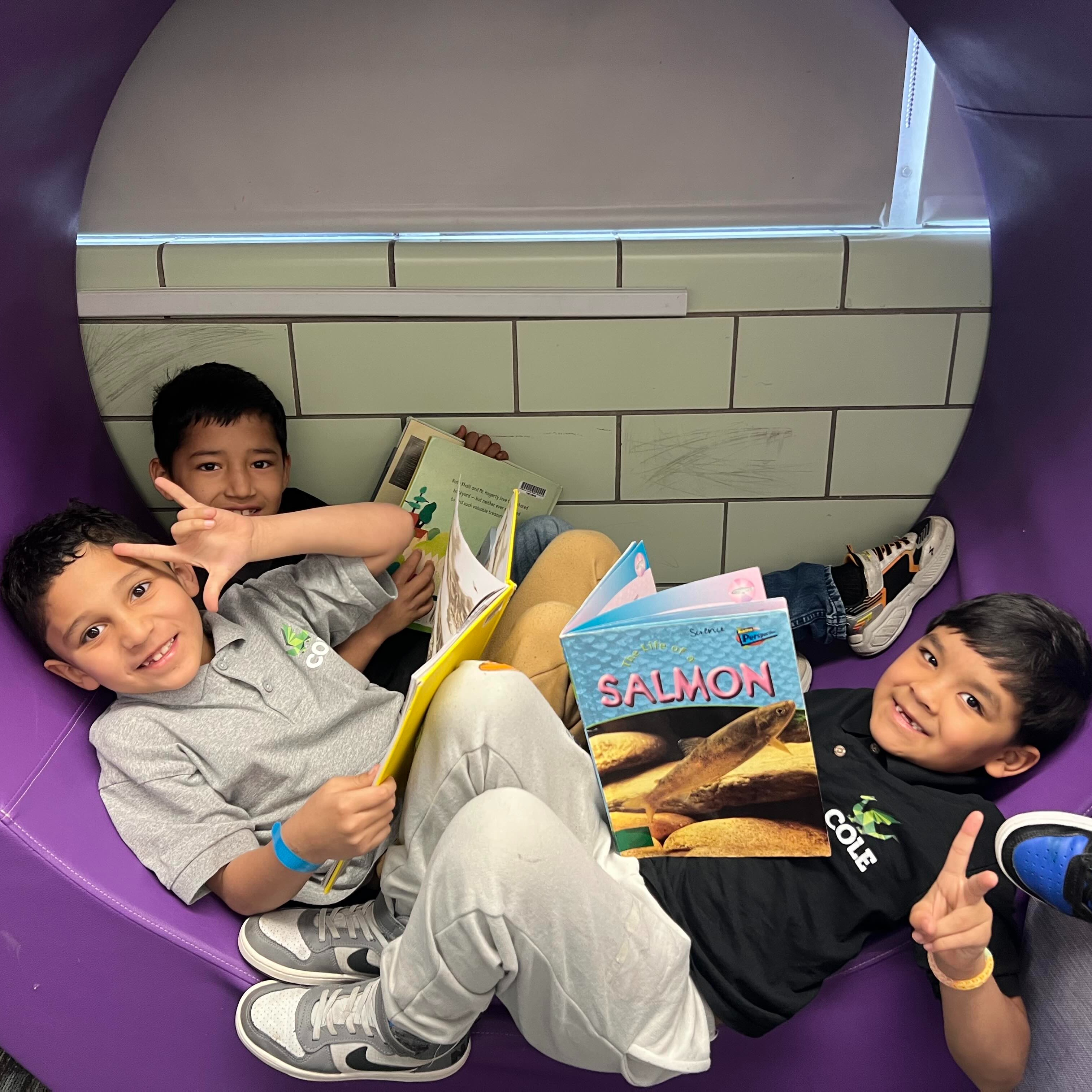 students smiling and reading