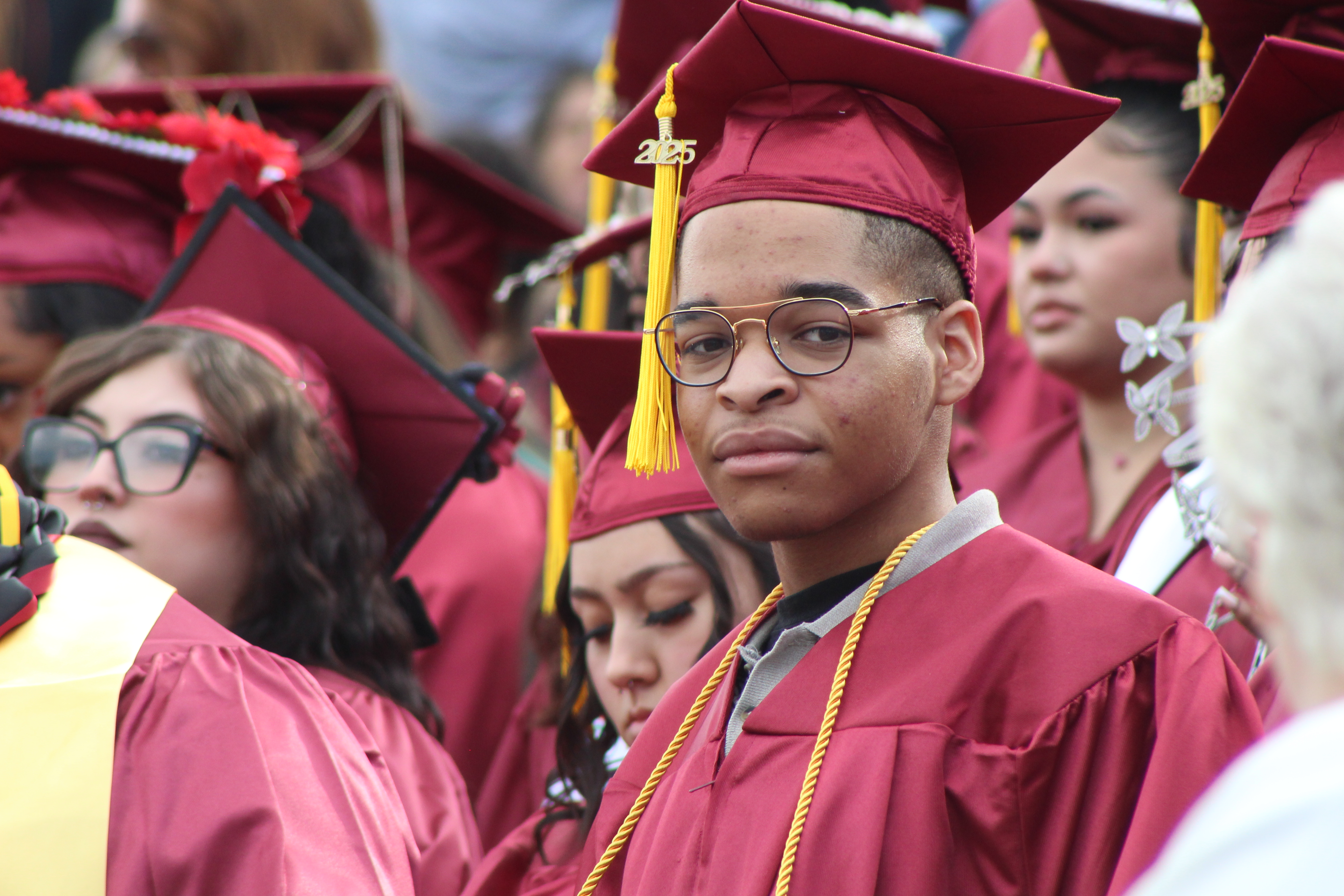 student looking forward at graduation