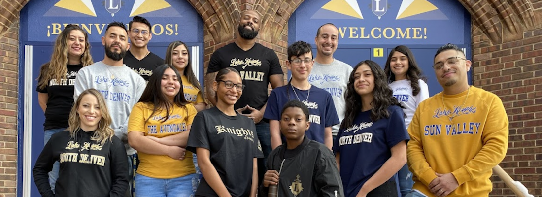 Group of people in front of school doors
