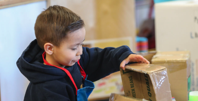 kid opening a box