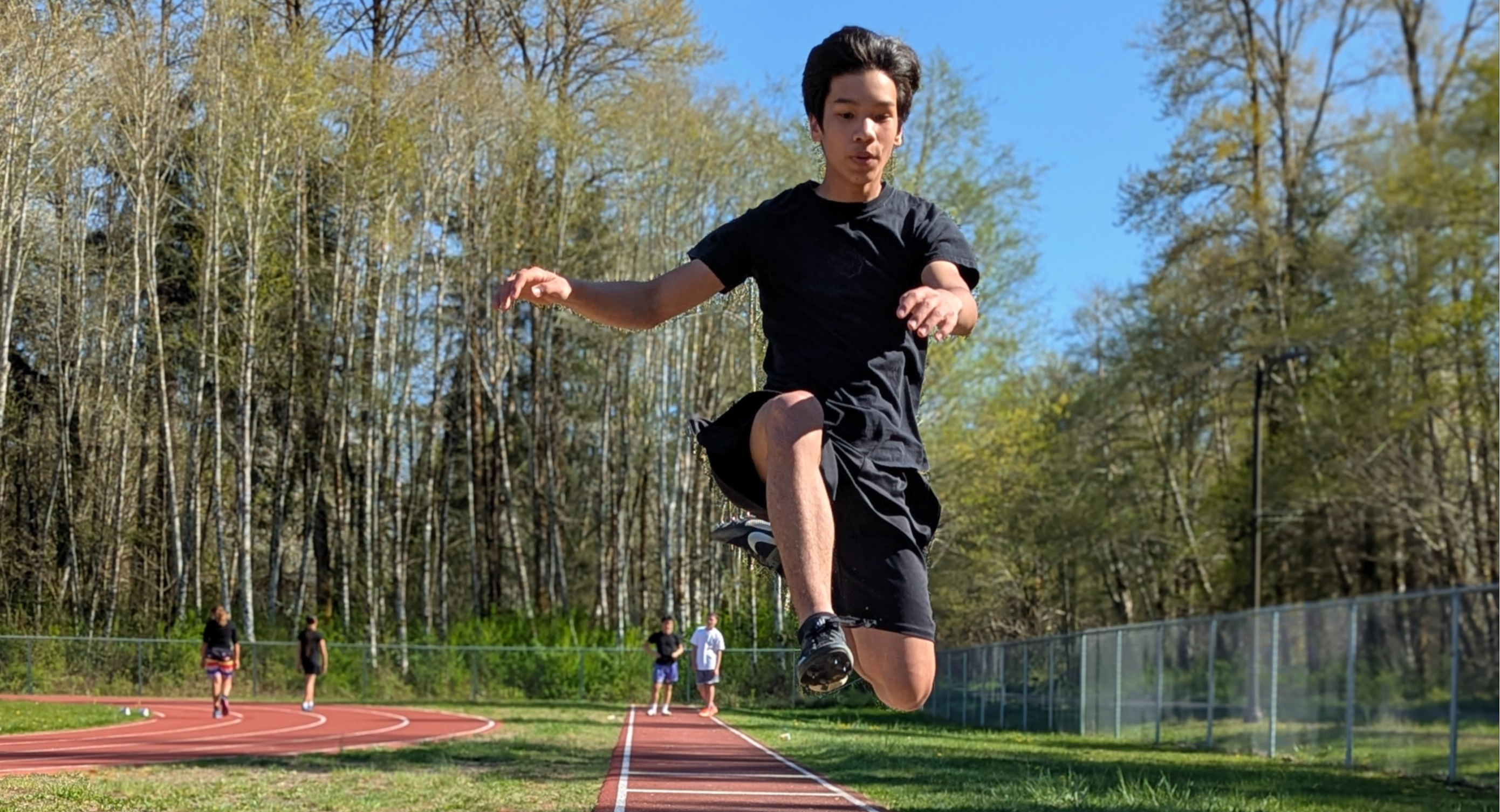Boy doing long jump