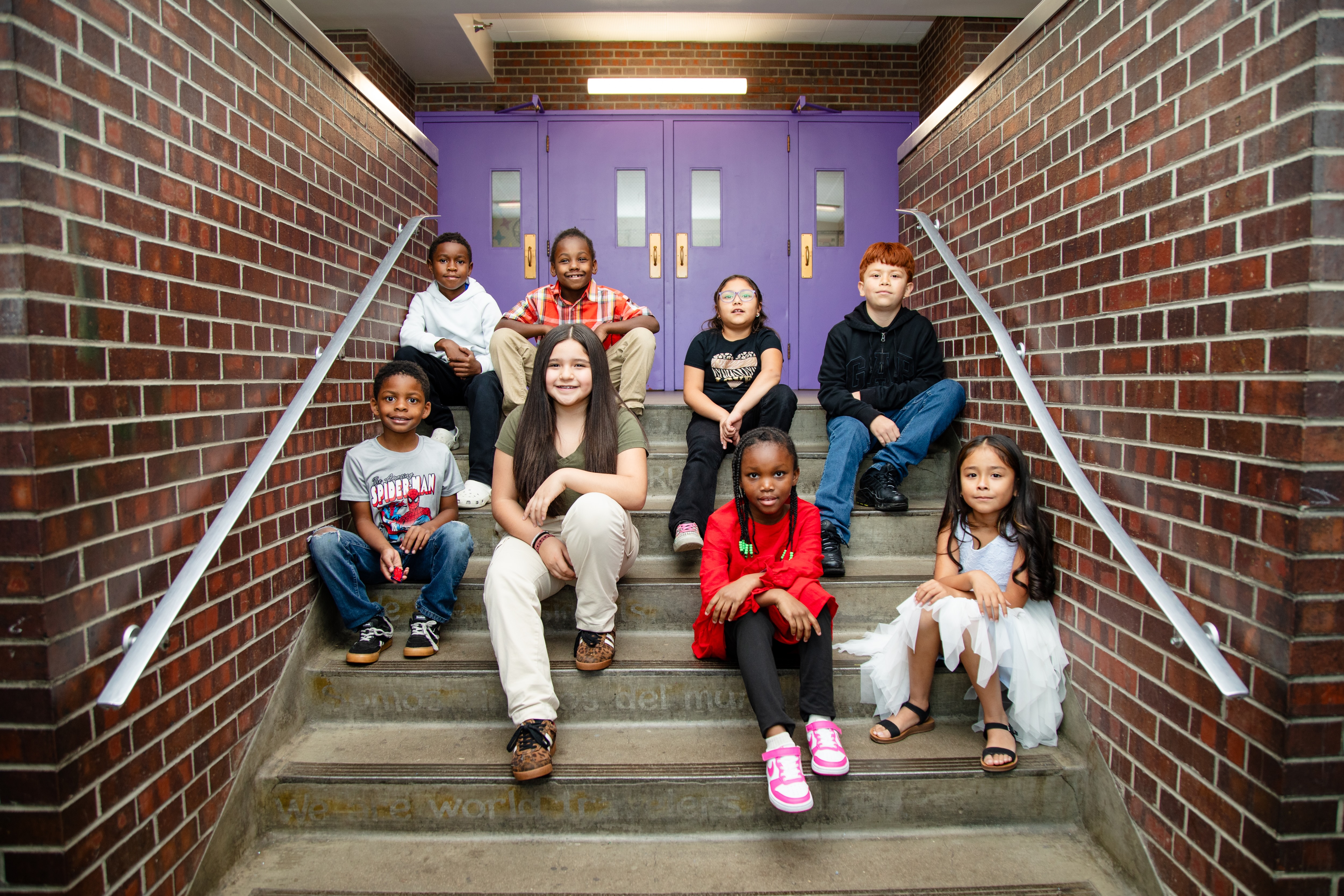 Students sitting in a stairwell