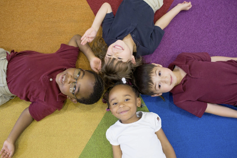 Kids on the floor smiling