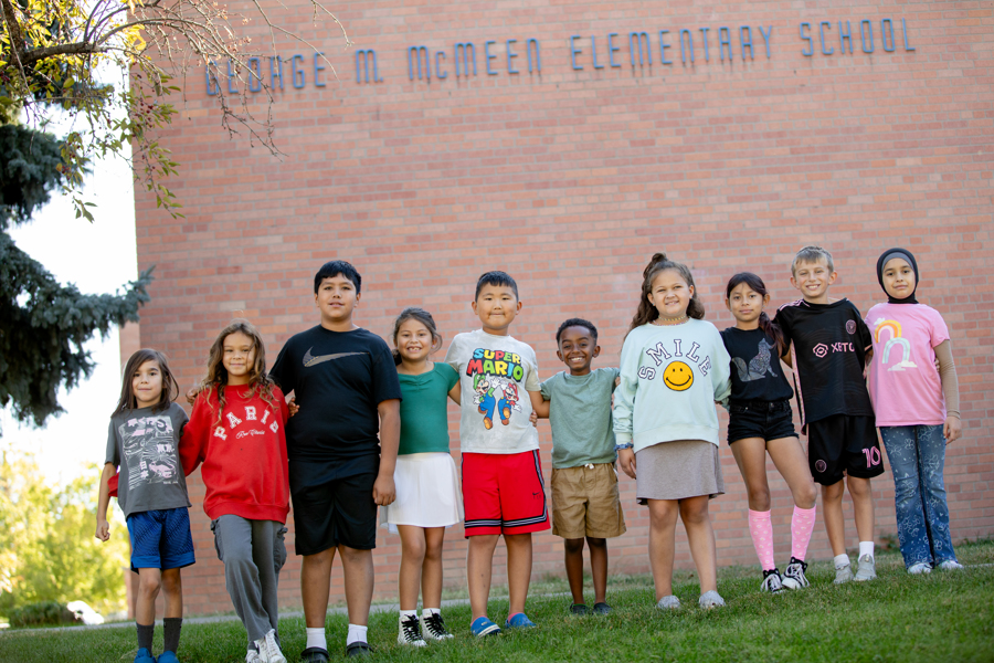 McMeen students standing in front of the school