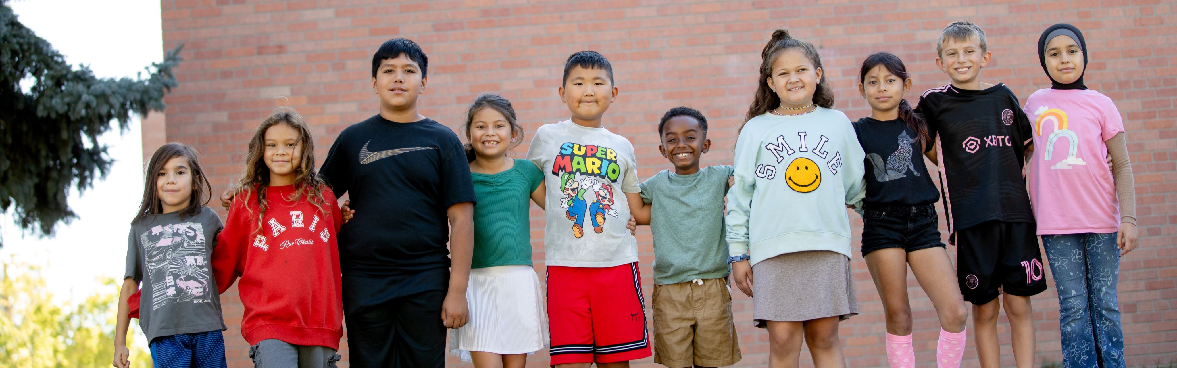 McMeen students standing in front of the school