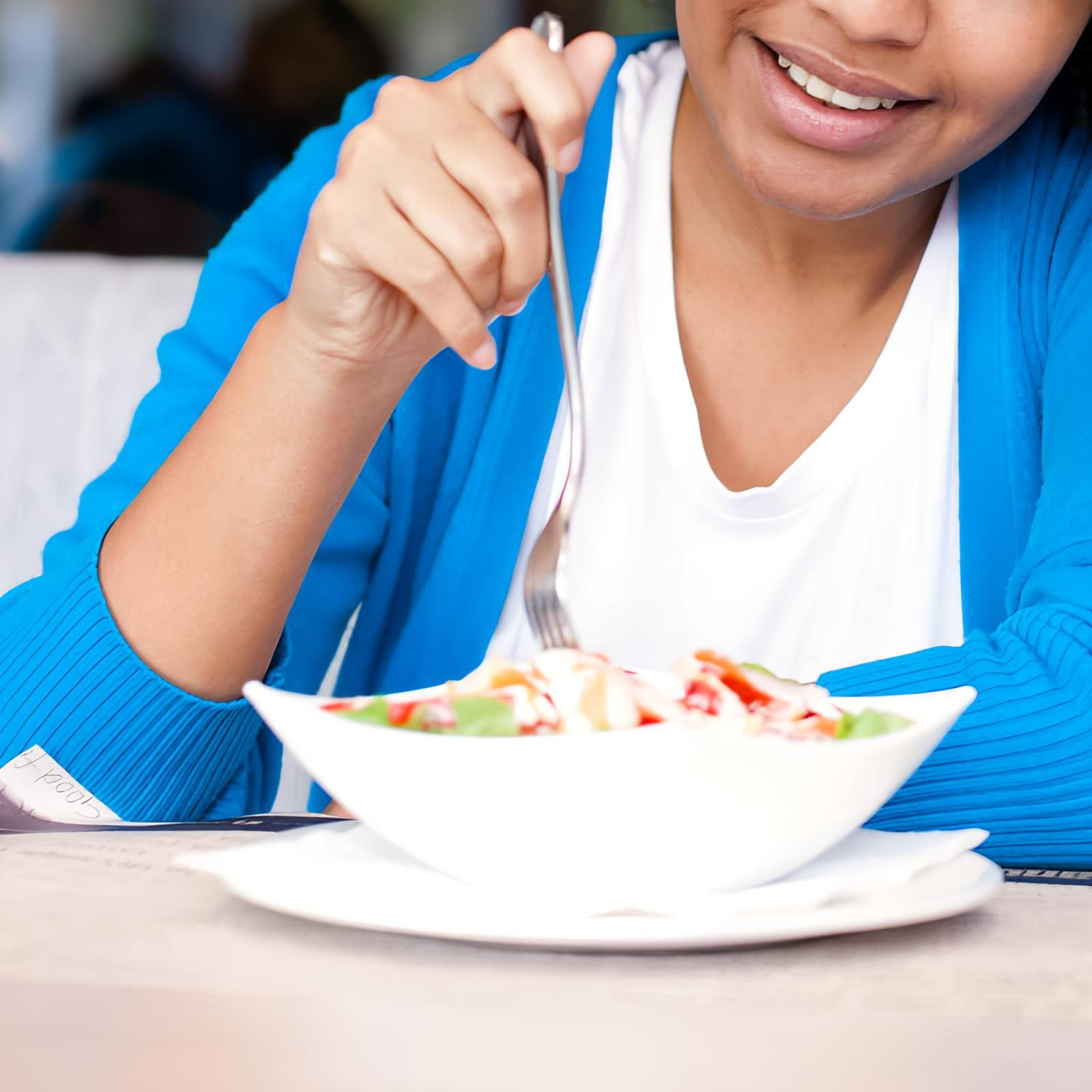 woman eating salad