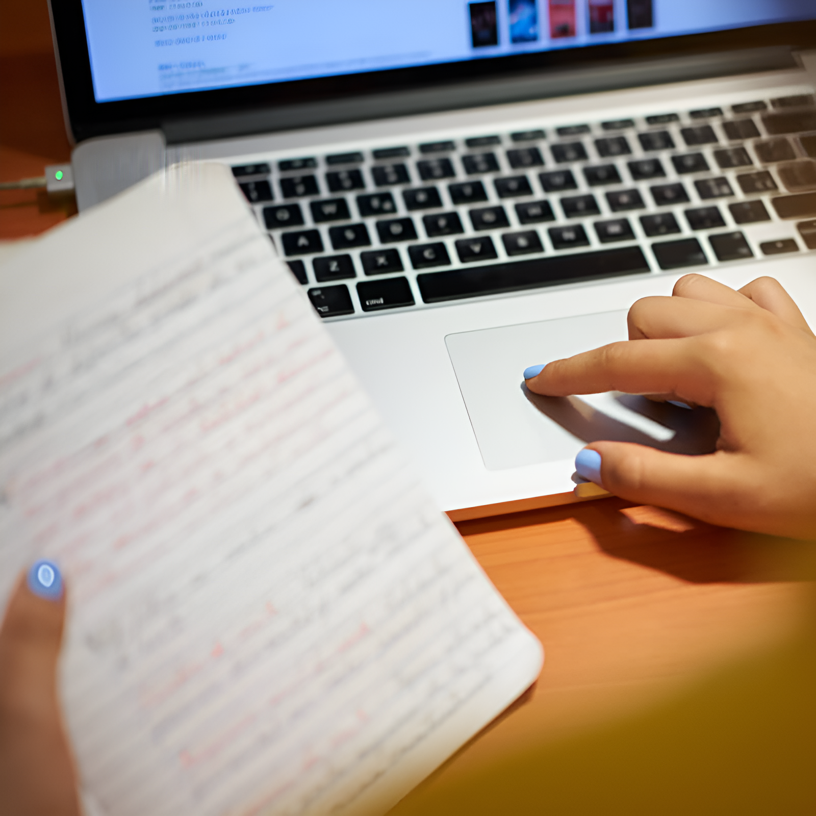 girl on her computer and notes