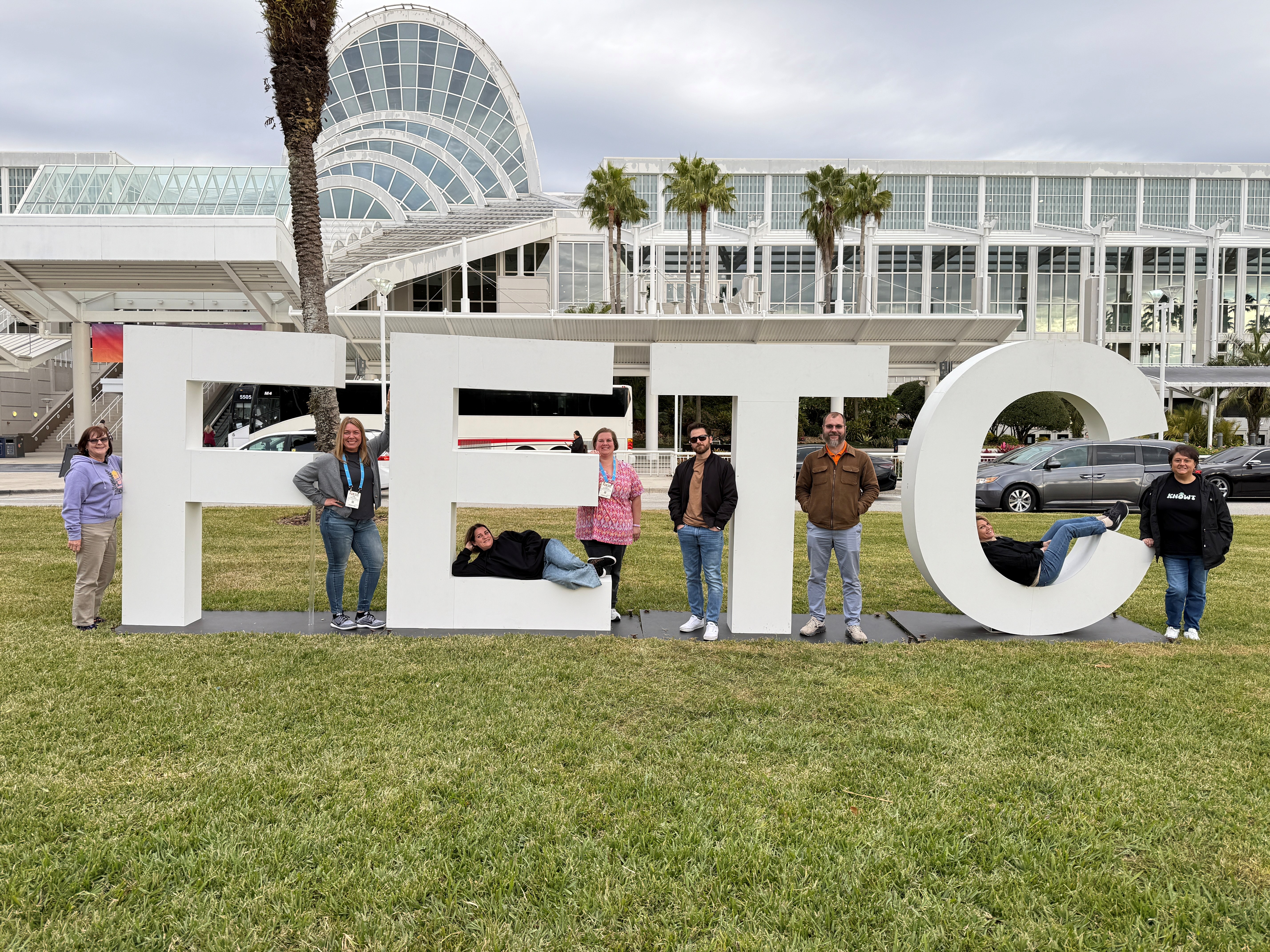 Tech integrators sitting in the FETC sign