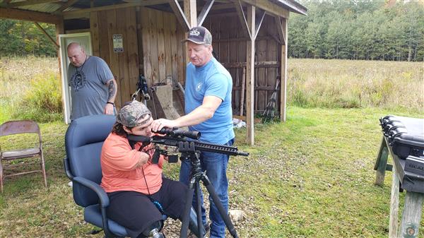 Memphis Lafferty and his father Chris Lafferty with their hunting gun.