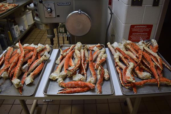 Crab legs are a popular seafood dish. They are typically steamed or boiled, and then served with melted butter or a dipping sauce.