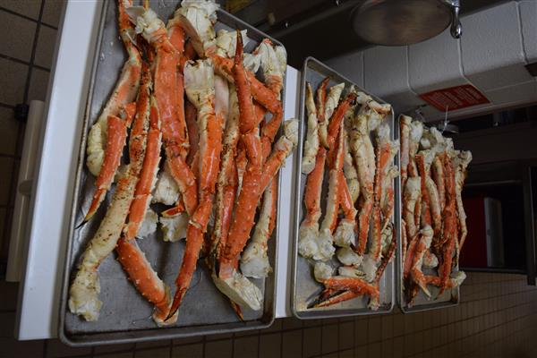 Crab legs are a popular seafood dish. They are typically steamed or boiled, and then served with melted butter or a dipping sauce.