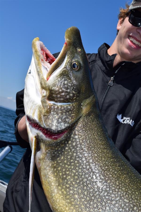 A man holding the large fish he catches