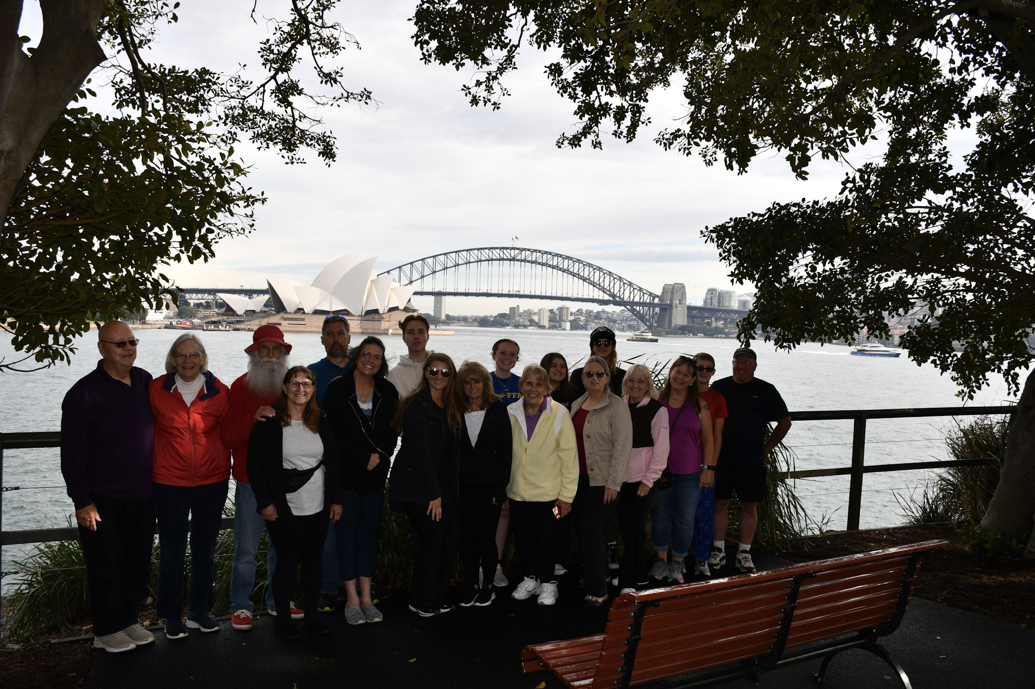 A group picture in front of water.
