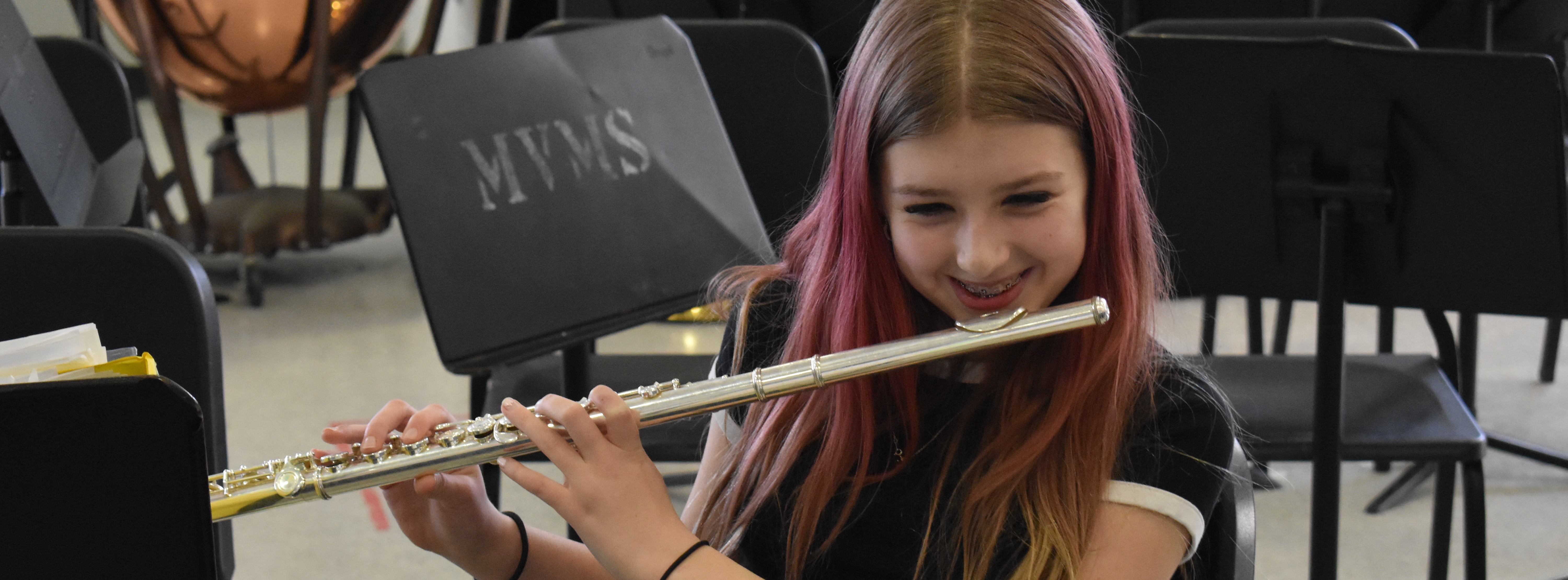 student in music class