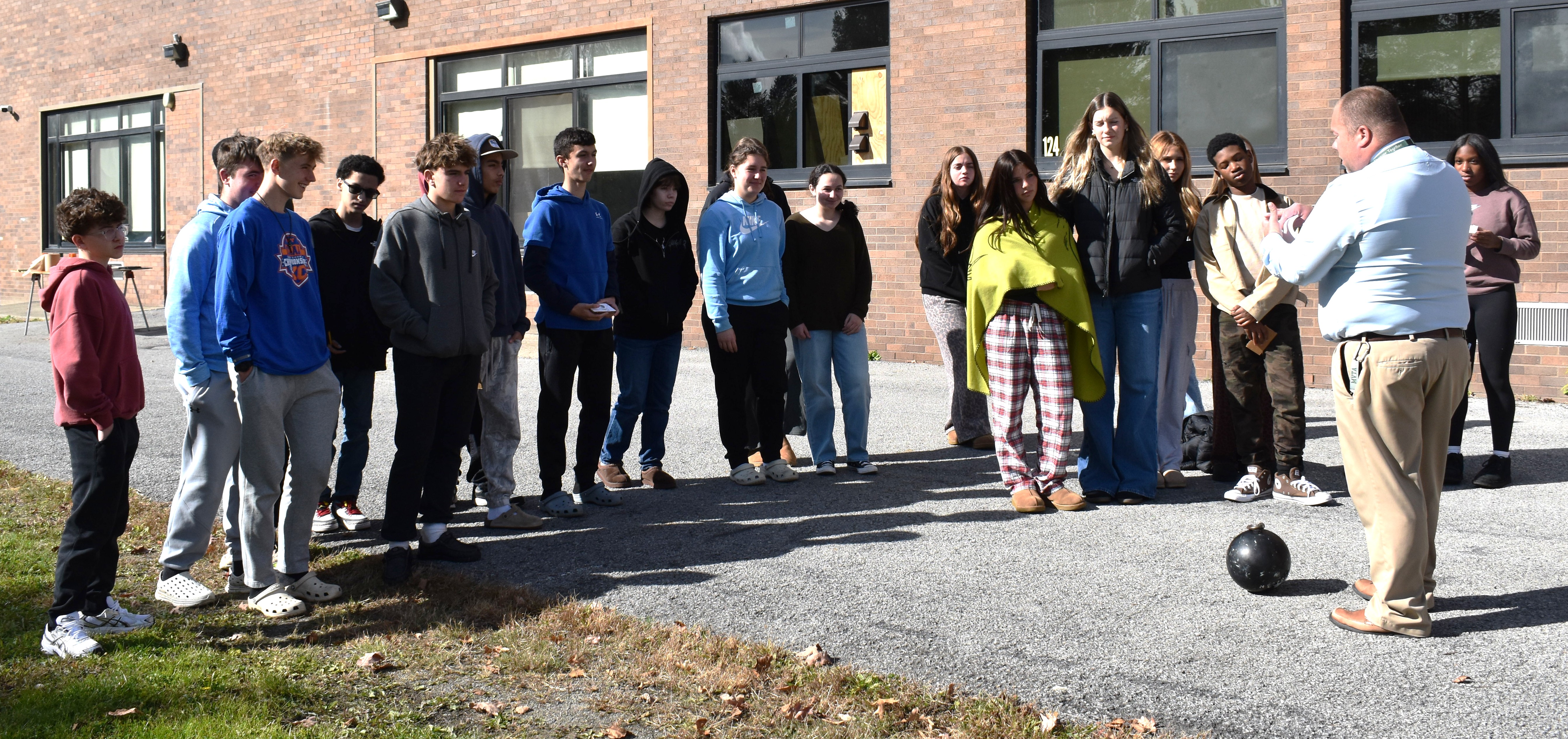 teacher with students outdoors