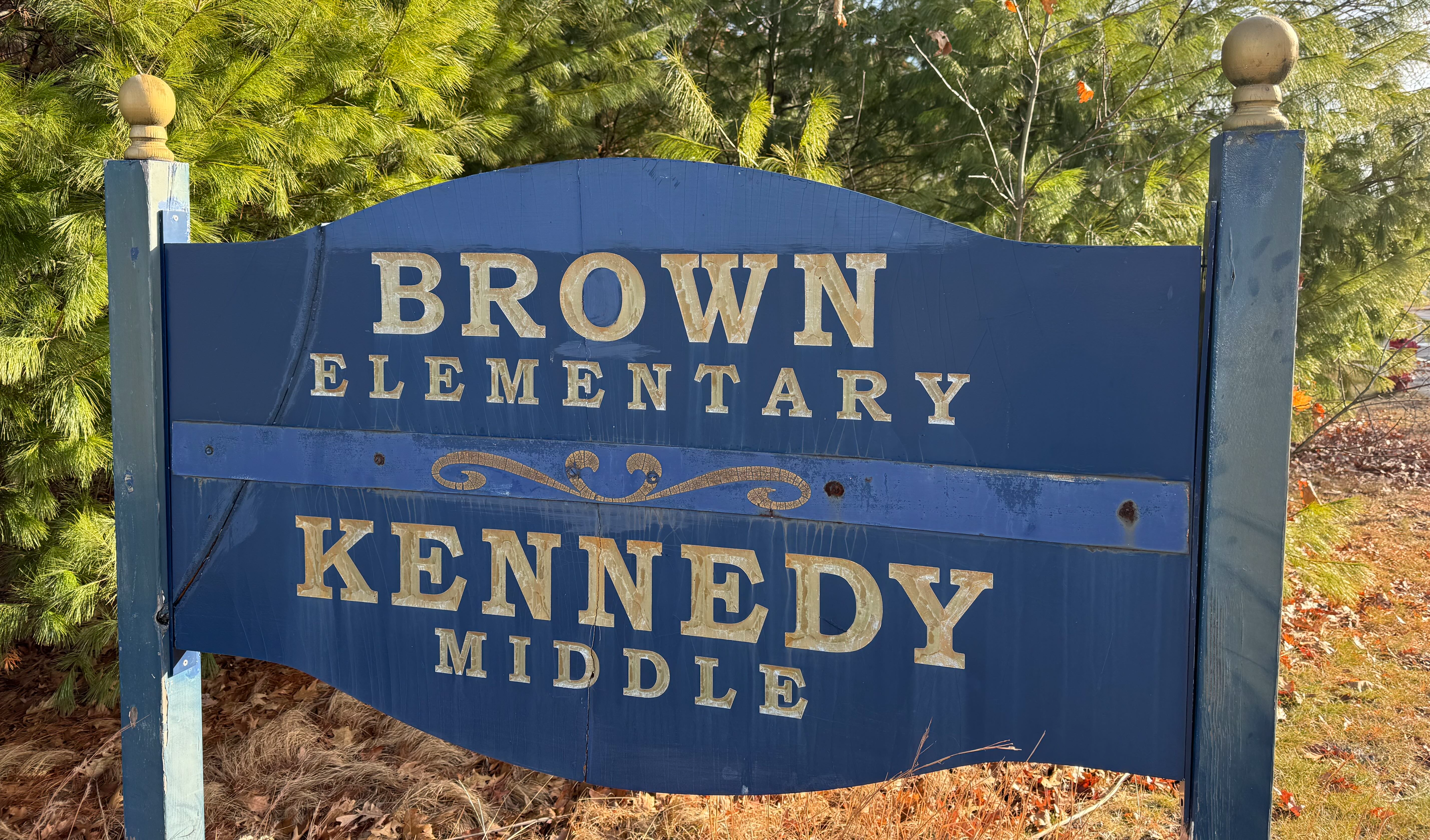 An image of the vintage entrance sign to the Brown and Kennedy Schools.