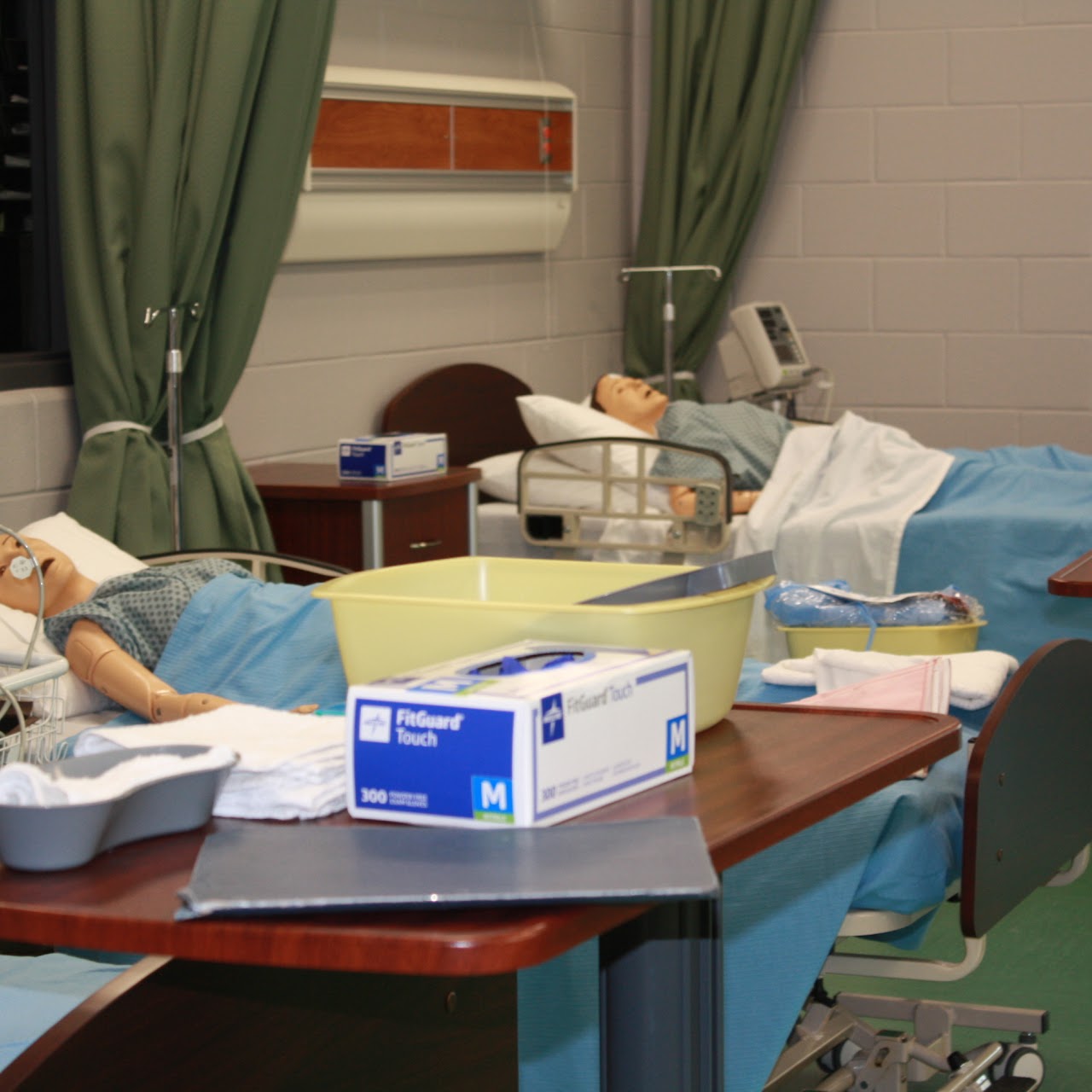 beds of mannequin patients in a hospital