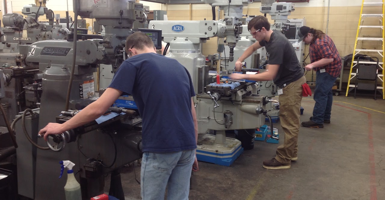 Students working with machinery 
