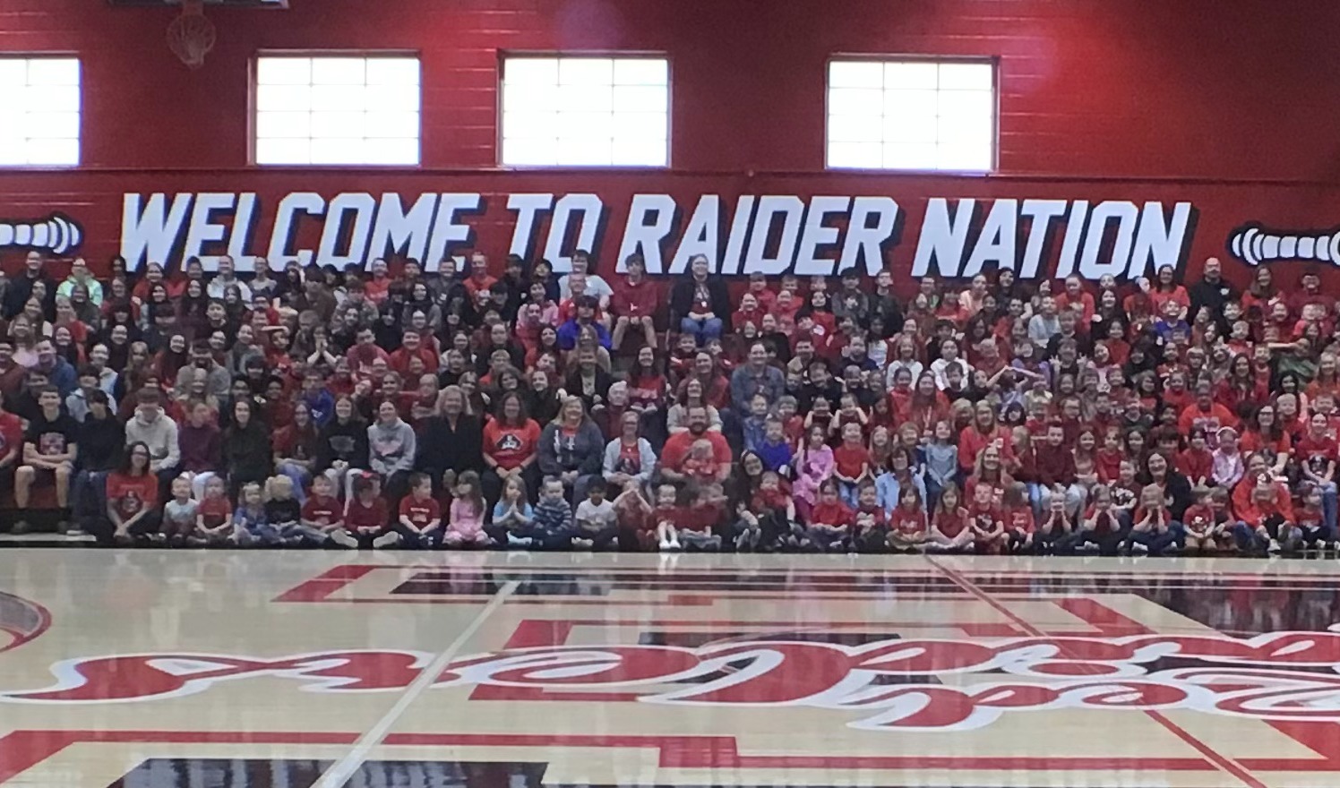 A whole district photo at the Portrait of a Graduate assembly 