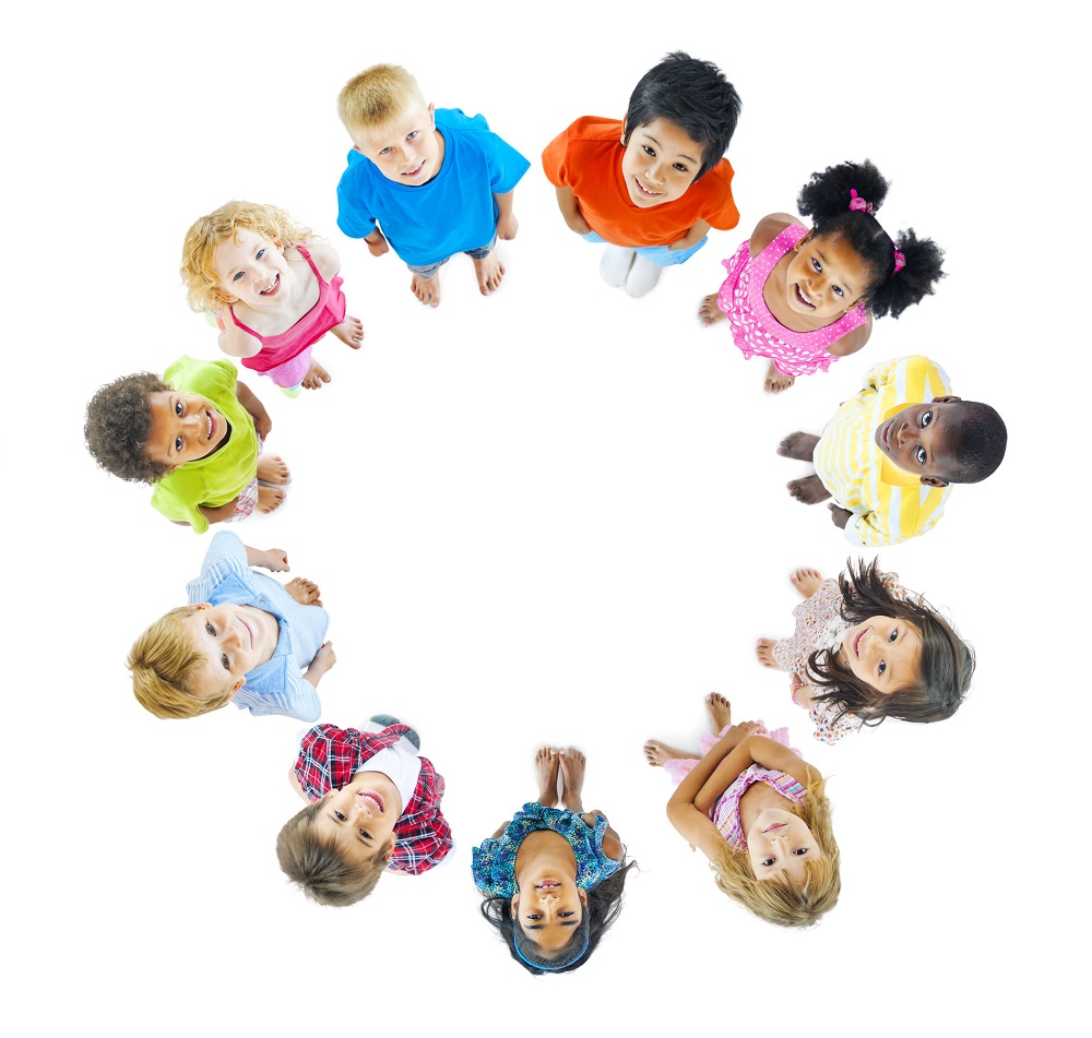 kids in a circle looking up