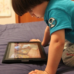 kid playing on a tablet