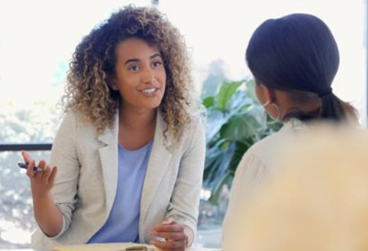 two woman talking