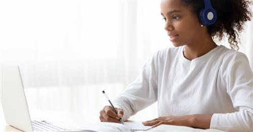 girl doing work on computer