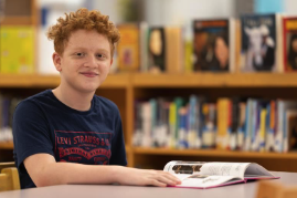 student with a book