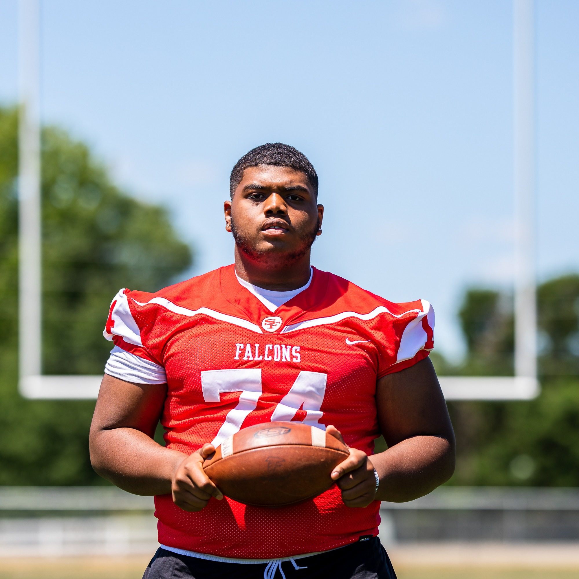 student with football