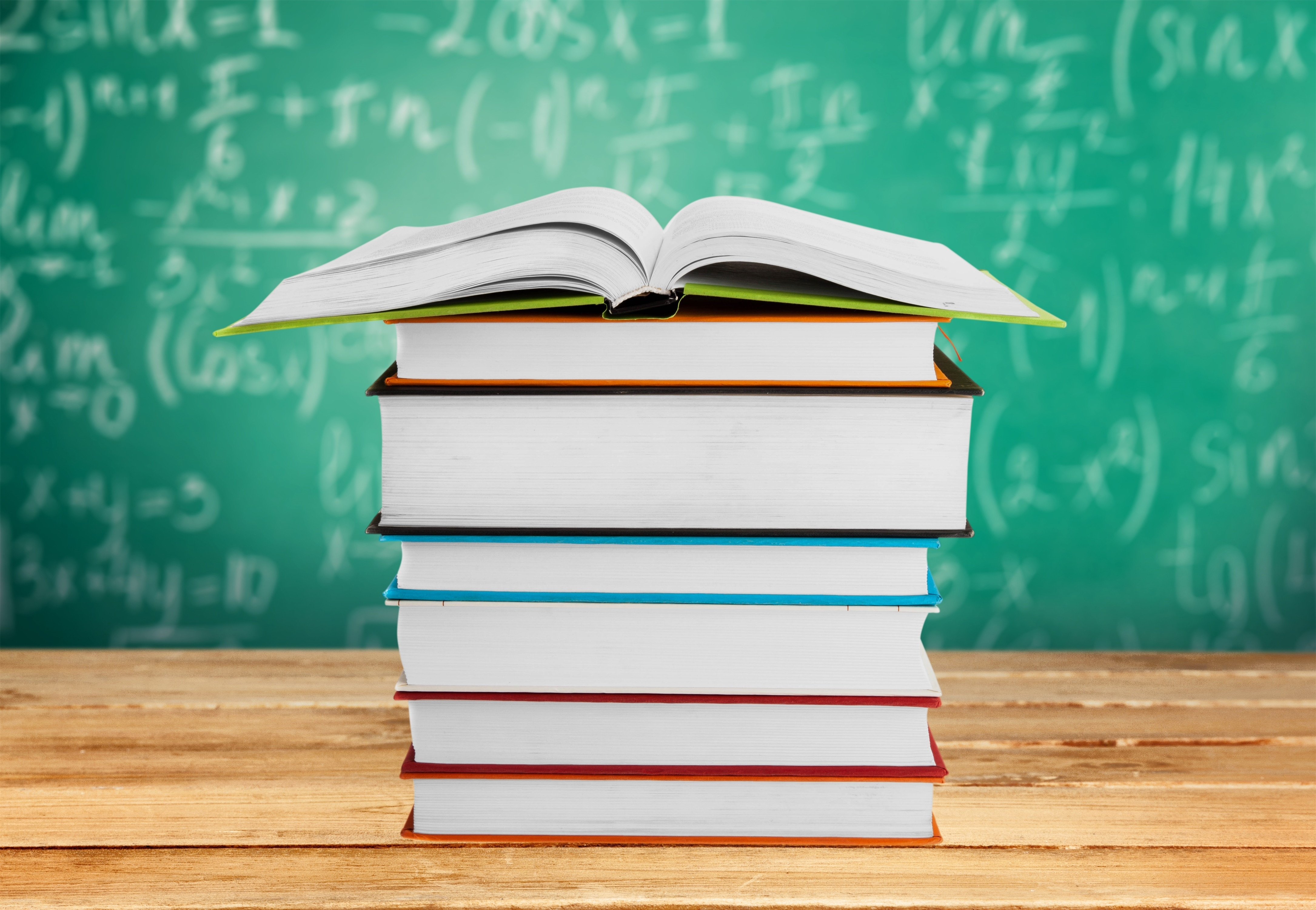 Textbooks Stacked on Table