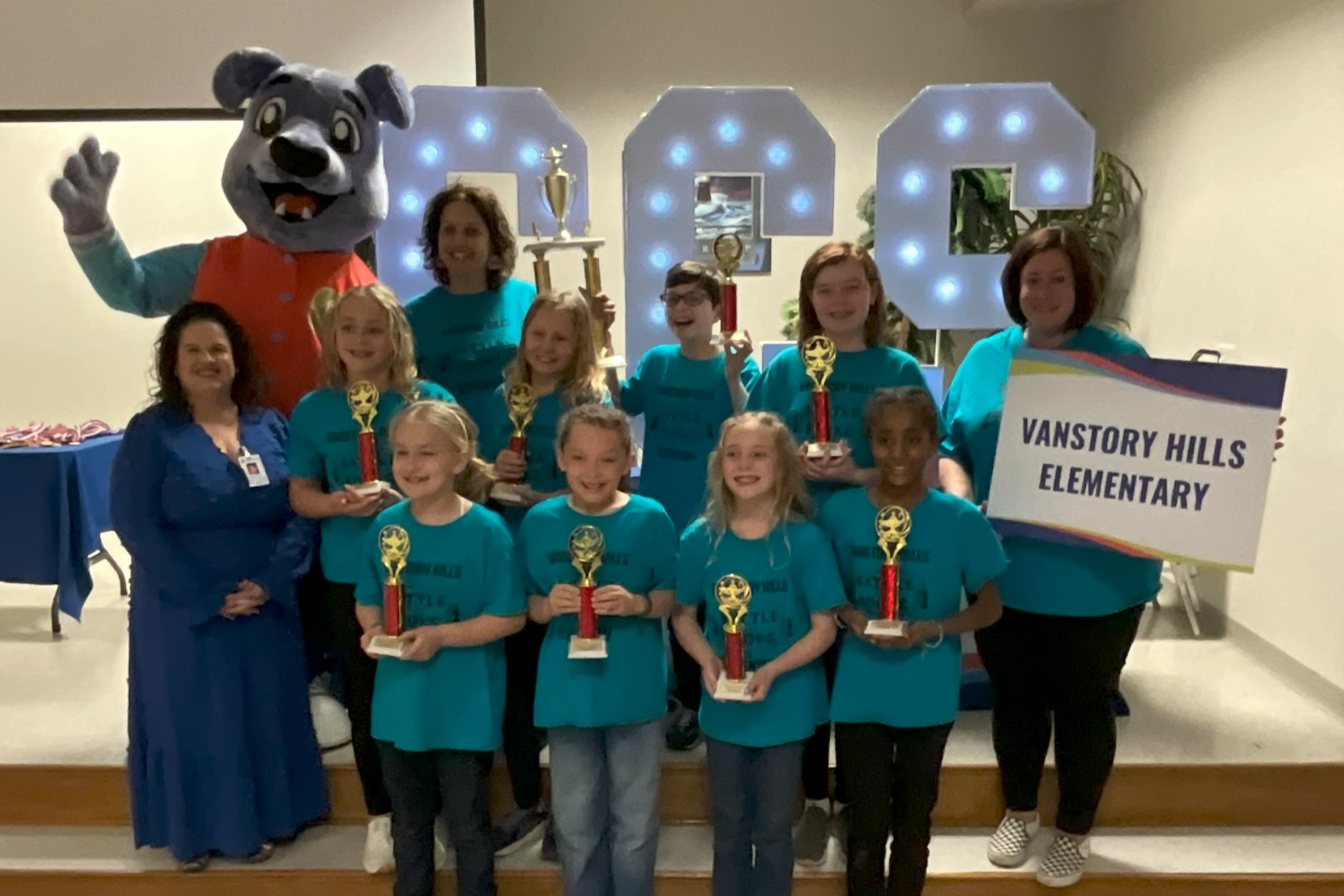 2025 Elementary School Battle of the Books Winning Team - Vanstory Hills Elementary School  Students and coaches with trophy