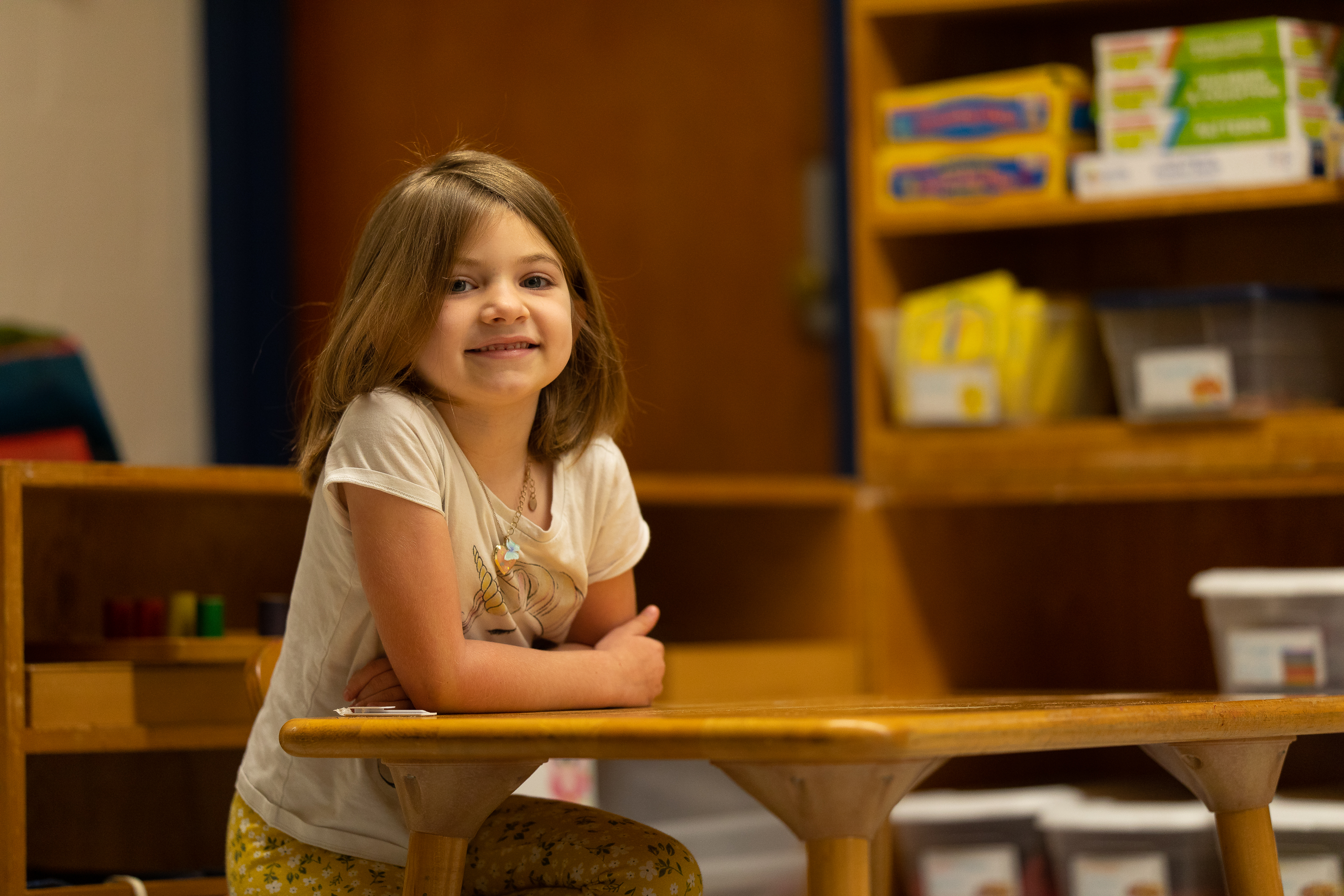 Young girl sitting at a desk