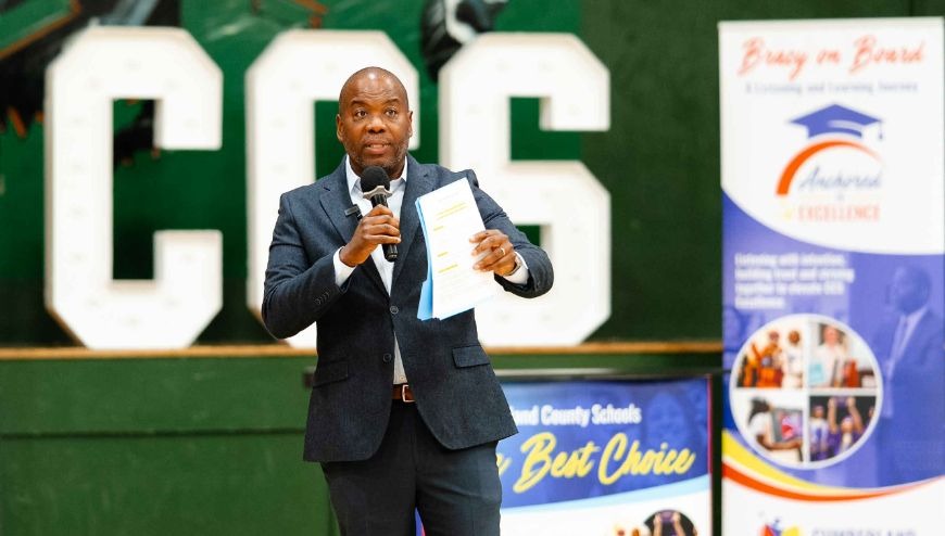 Dr. Bracy with microphone