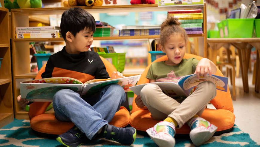Students in the classroom with books