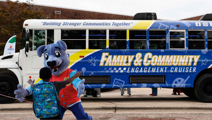 image of Family & Community Engagement Cruiser vehicle with mascot and student