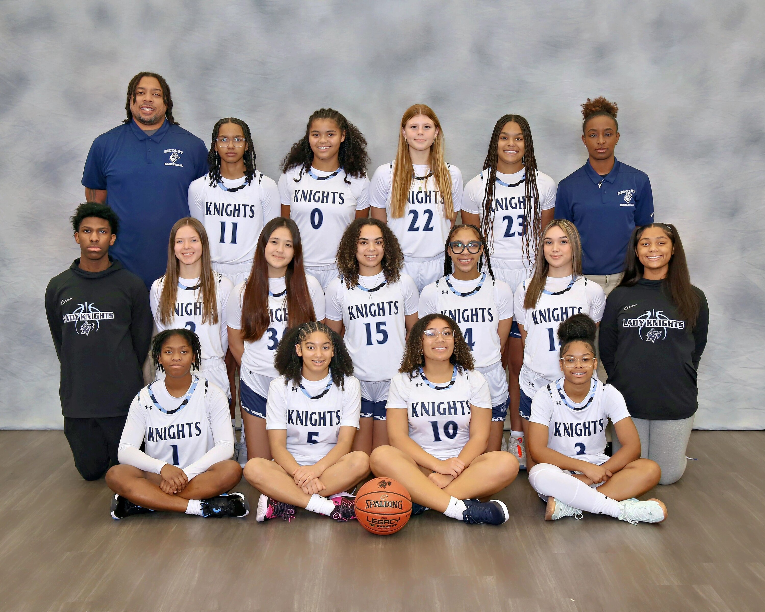 varsity girls basketball players smiling