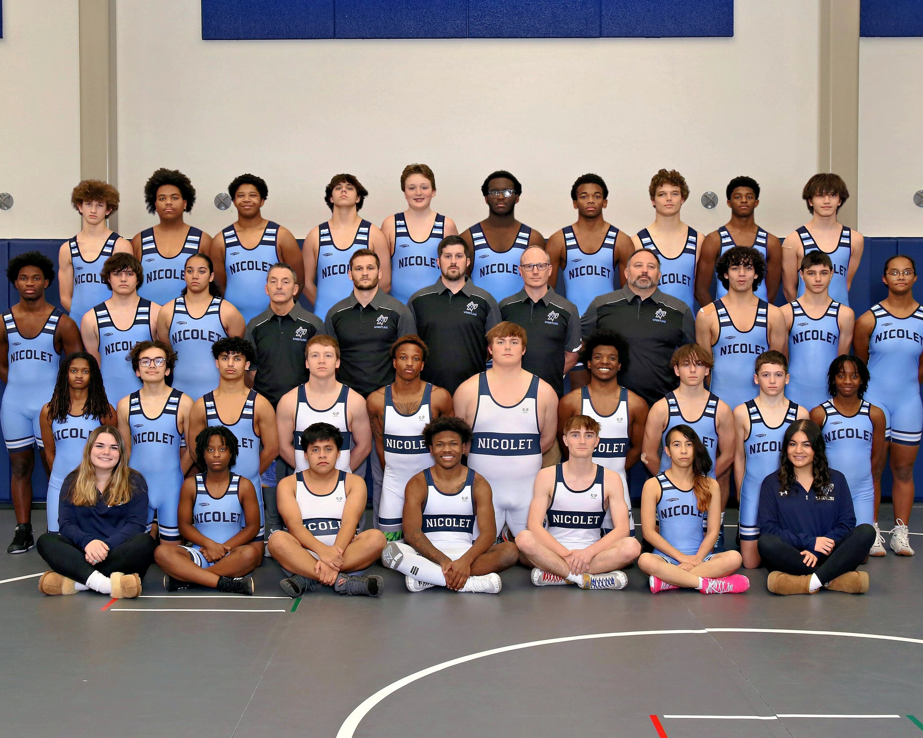 team picture of the nicolet wrestling team posing for a picture