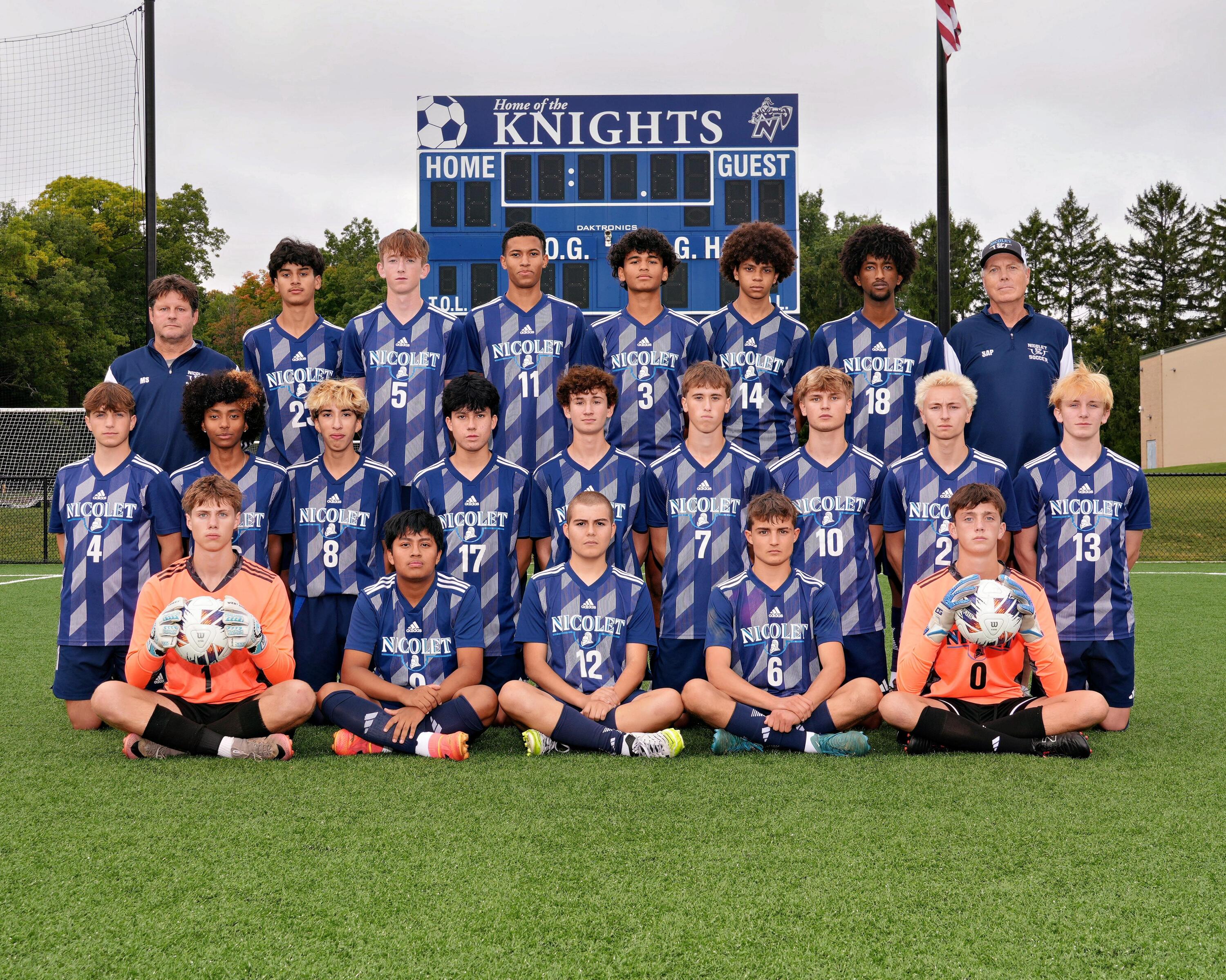 a picture of boys soccer players smiling