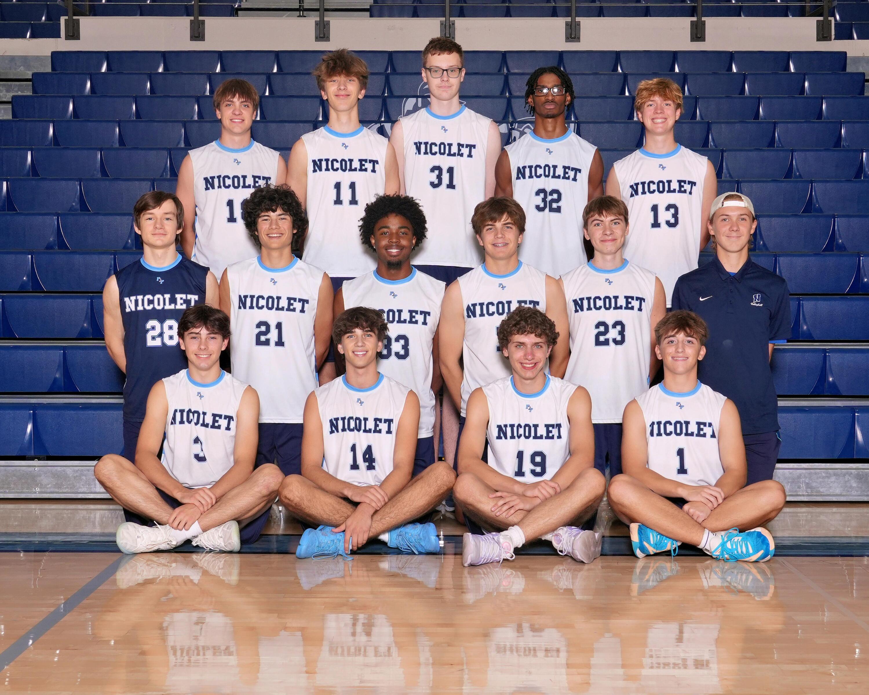 a picture of boys volleyball players smiling for a picture