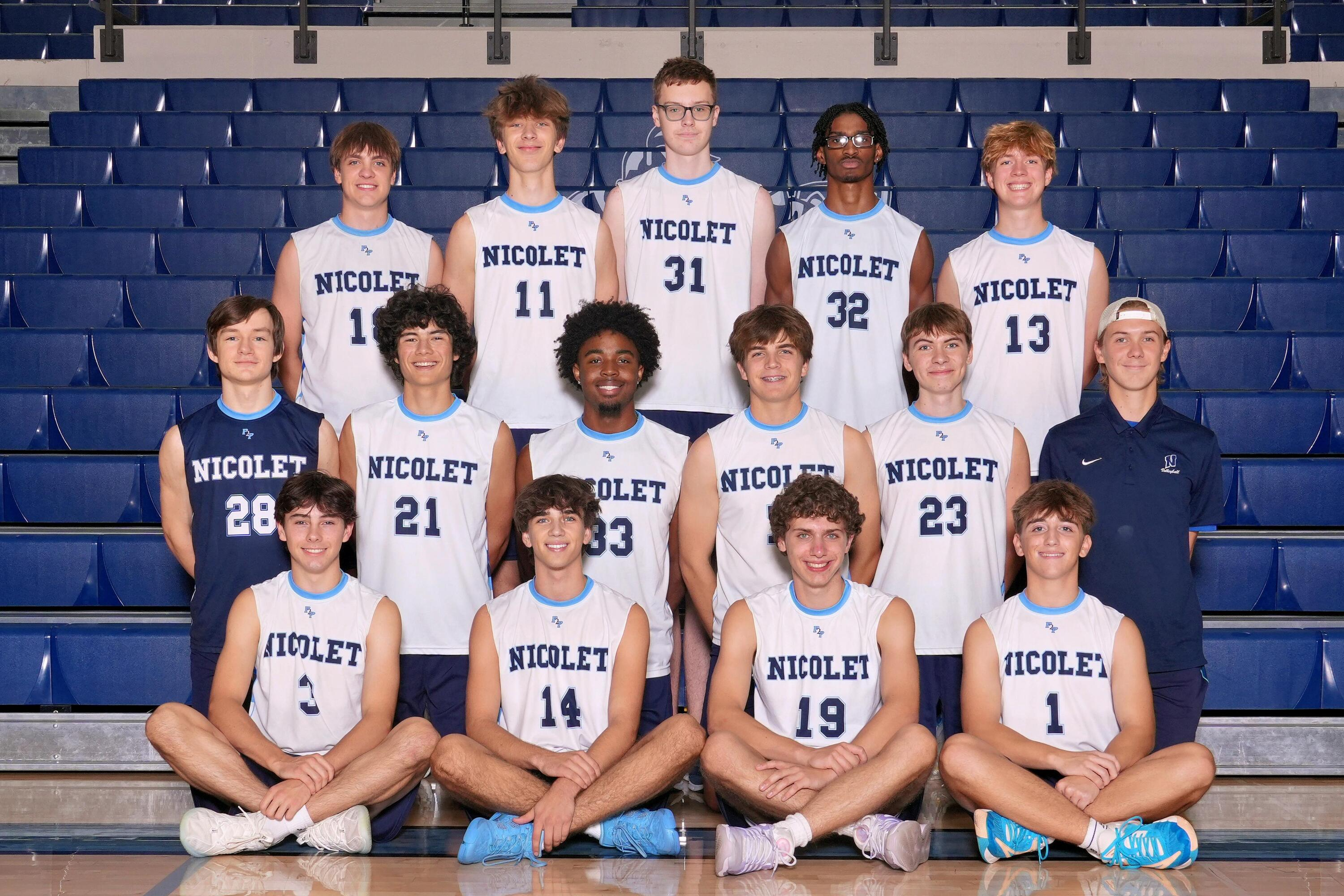 a picture of boys volleyball players smiling for a picture